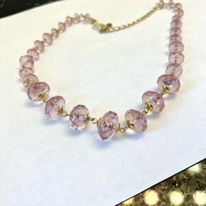 Lovely pink faceted bead necklace set in gold tone